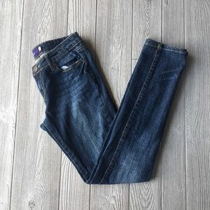 distressed dark blue jeans